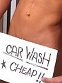 Billy gets all soaped up washing a car.