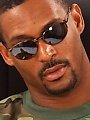 Ebony GI Joe in aviator shades and a sexy jock strap