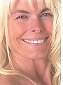 Blonde granny shows off her enormous fake boobs...
